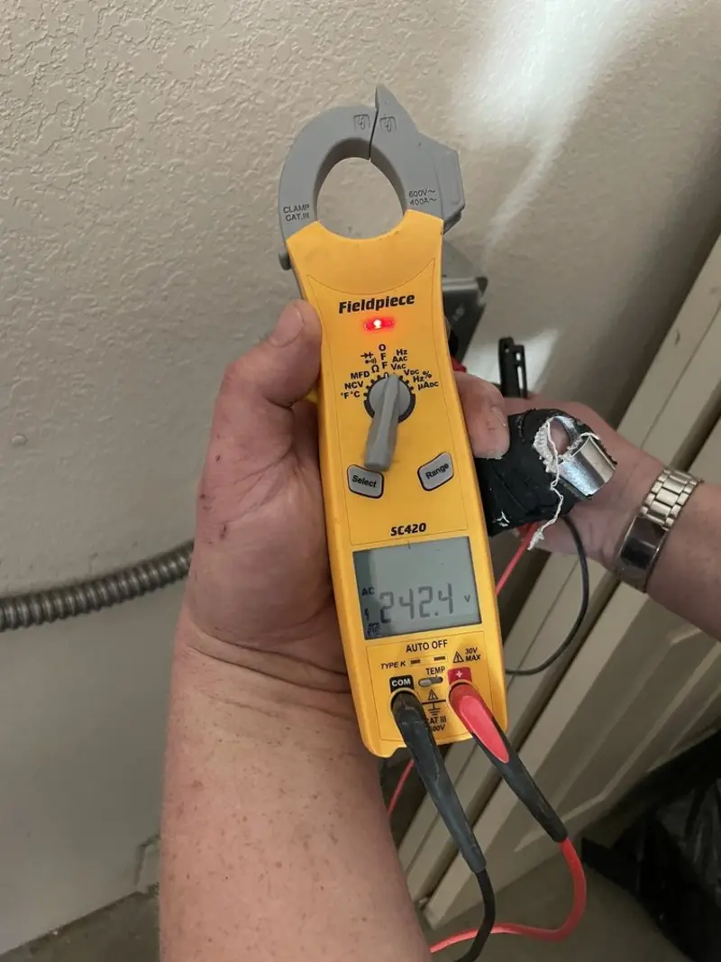 Voltage testing with clamp meter during Recessed Lighting Installation in East Peoria